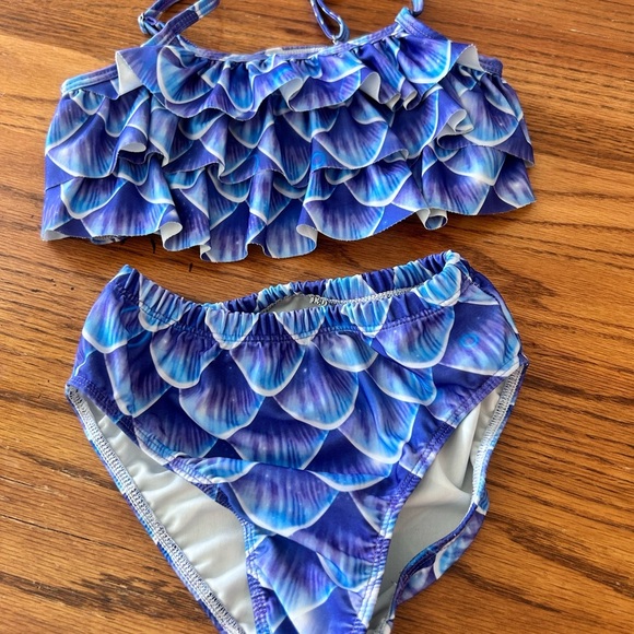 Girls Bathing Suits Set of 7
Size 6-8 - Picture 14 of 15